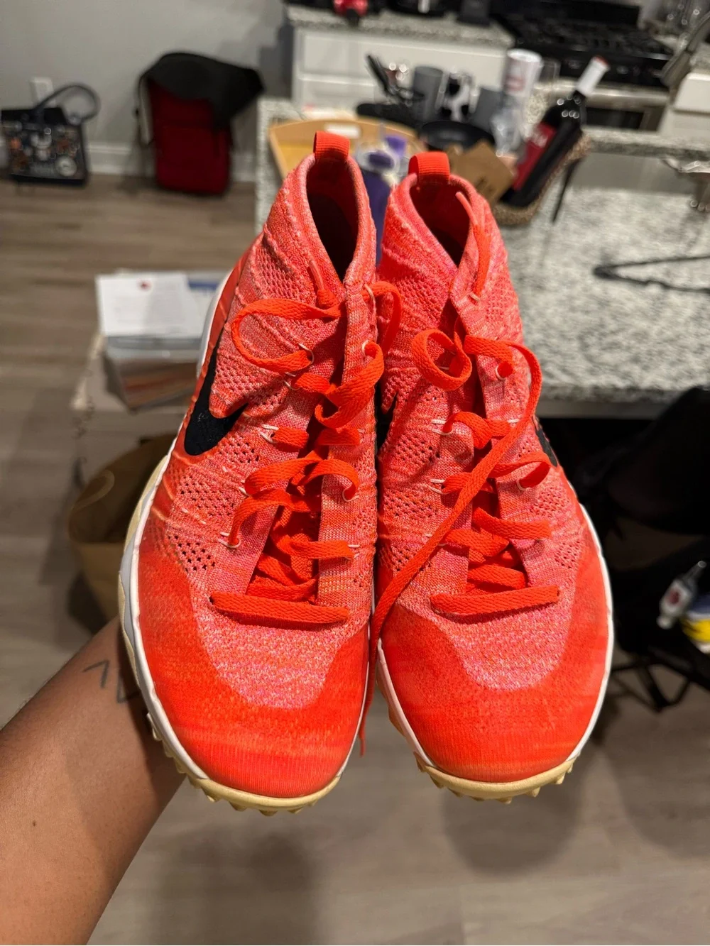 Nike Orange Flyknit Training Sneakers with Black Swoosh